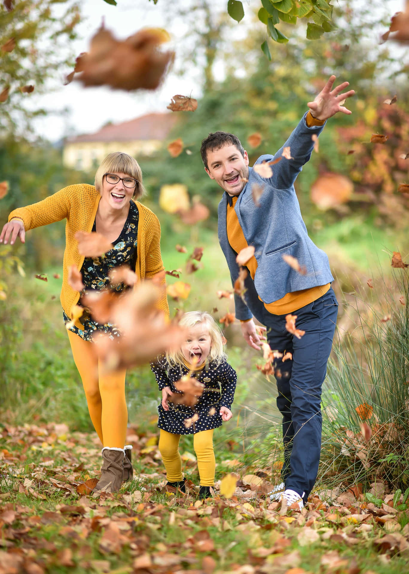 Family Fall Throwing Leaves Pictures