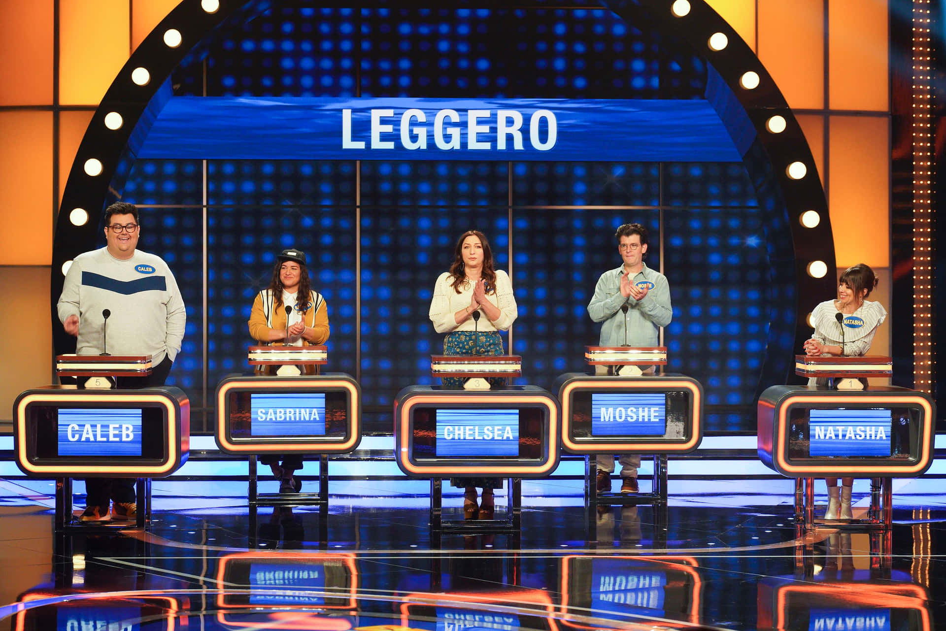 A Group Of People Standing On Stage With The Word Leggero
