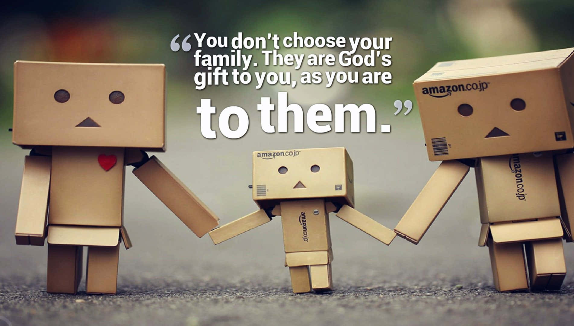Family Gift Quotewith Cardboard Figures Wallpaper