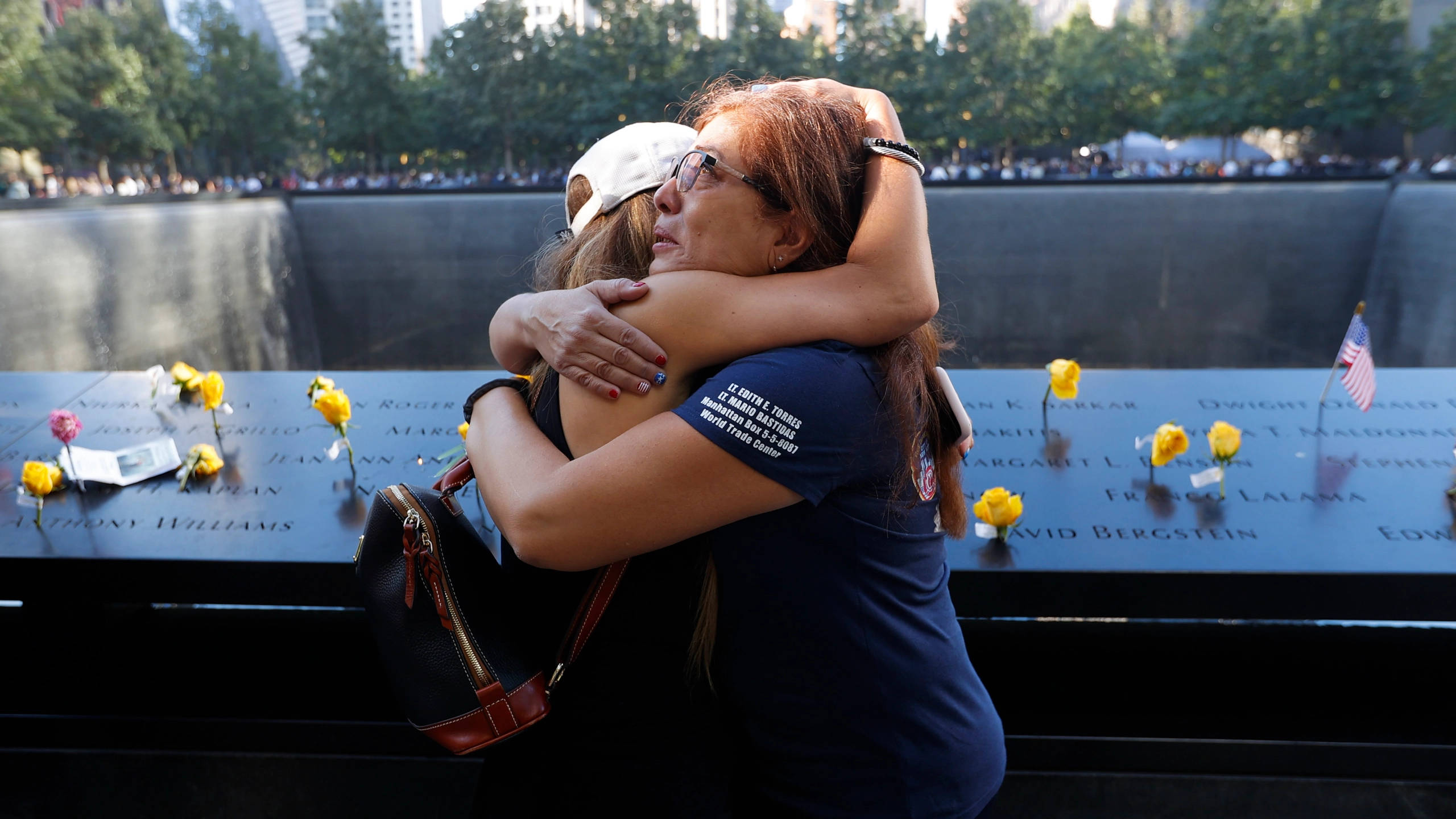 "Grieving Family Paying Respect at the 911 Memorial" Wallpaper