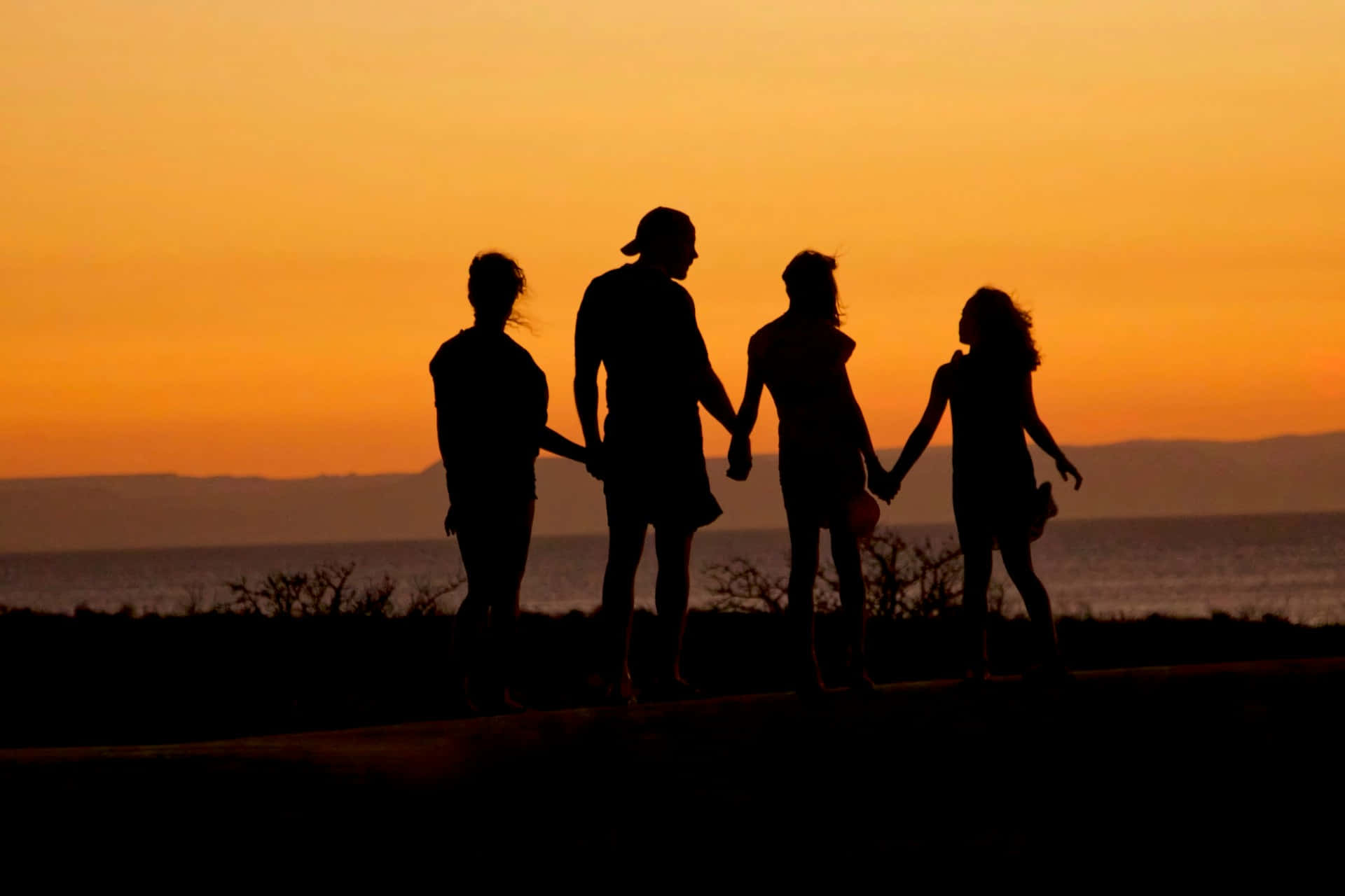 Family Silhouette Sunset Walk Wallpaper