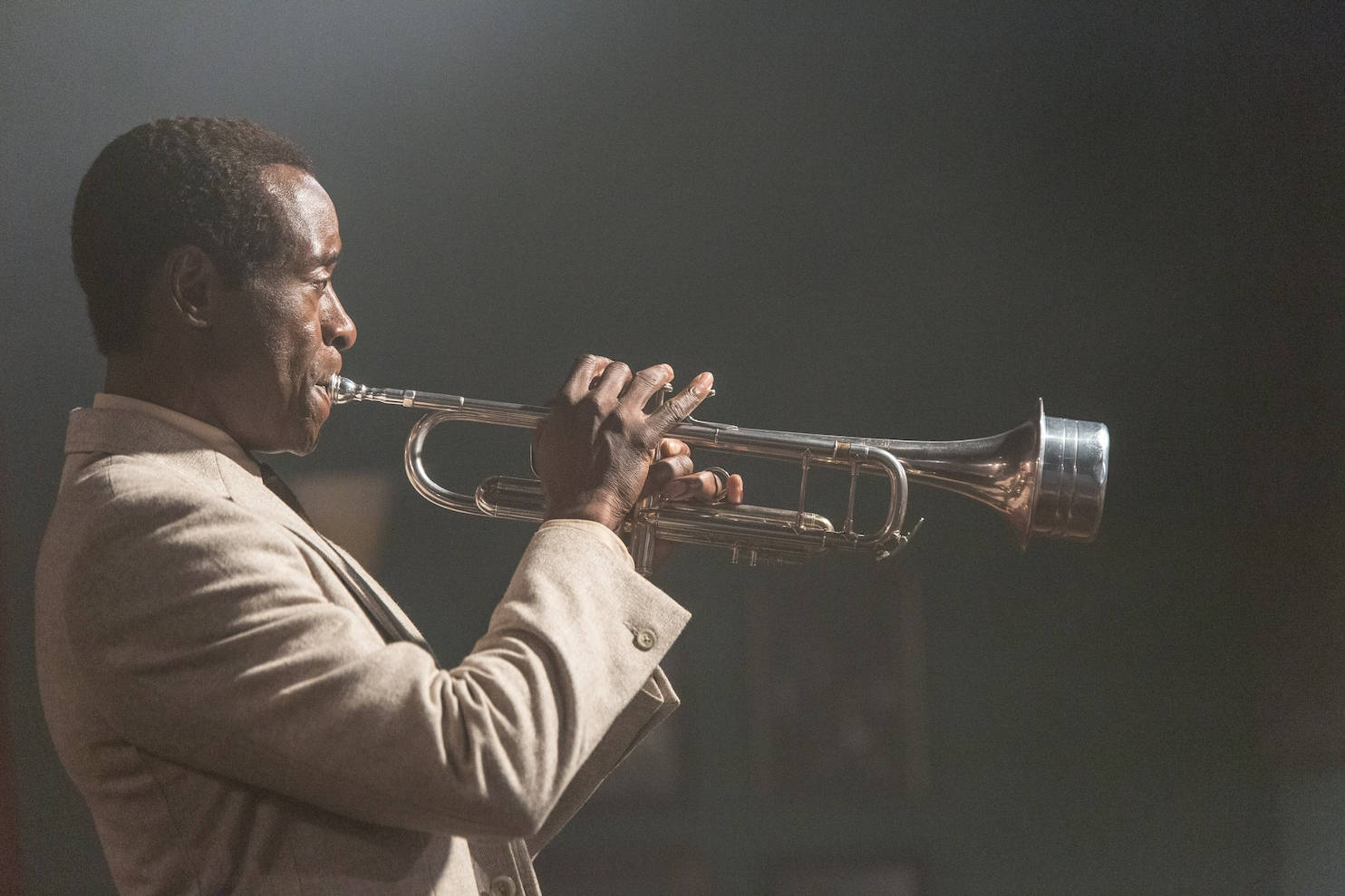 Legendary Jazz Artist Miles Davis with His Trumpet Wallpaper