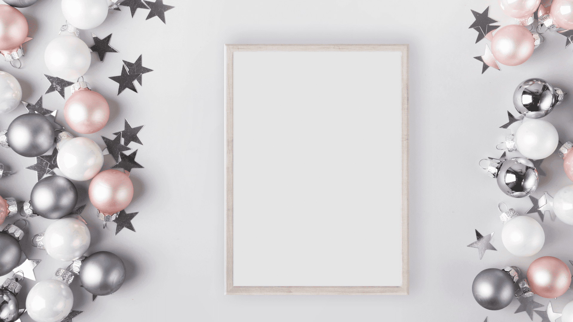 a white frame with silver and pink balloons and stars Background — A minimalist white frame centered on a light gray surface surrounded by festive silver pink and white ornaments and black stars.