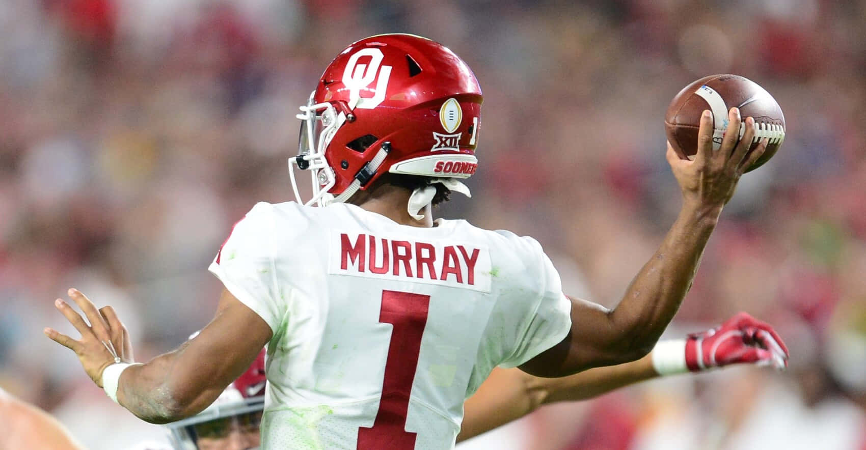 Oklahoma Quarterback Mike Murray Throws The Ball During A Game