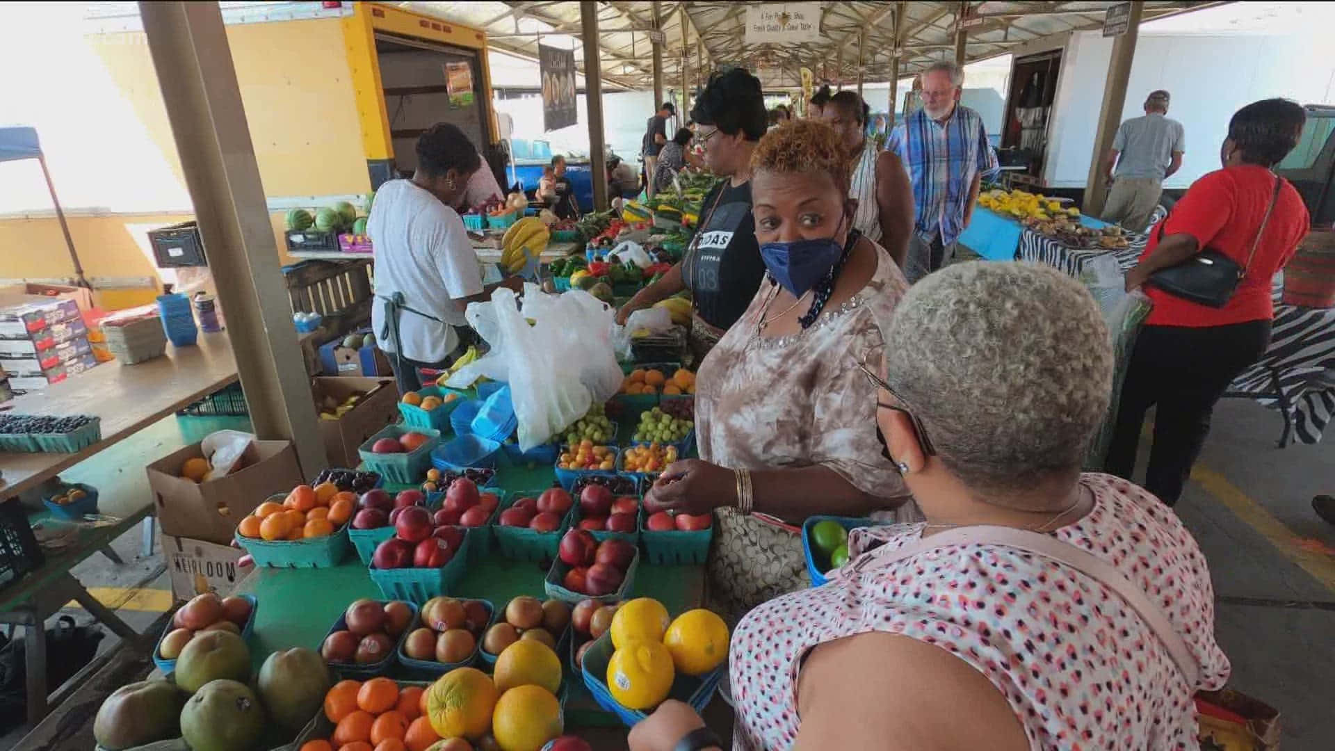 Fresh produce at a vibrant Farmers Market Wallpaper