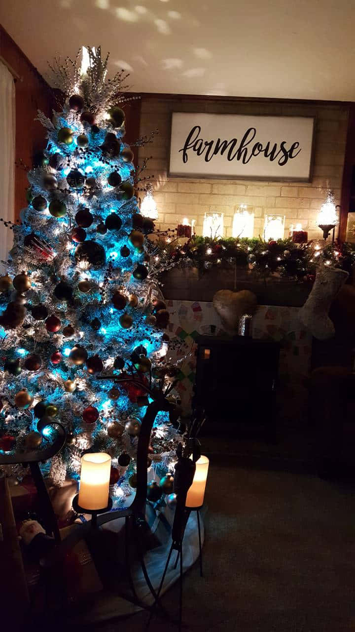 Farmhouse Christmas Tree With Blue And White Lights Wallpaper