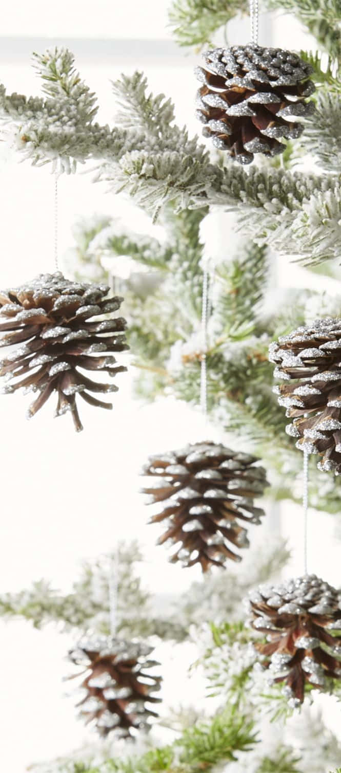 Farmhouse Christmas Tree With Pine Cone Decorations Wallpaper