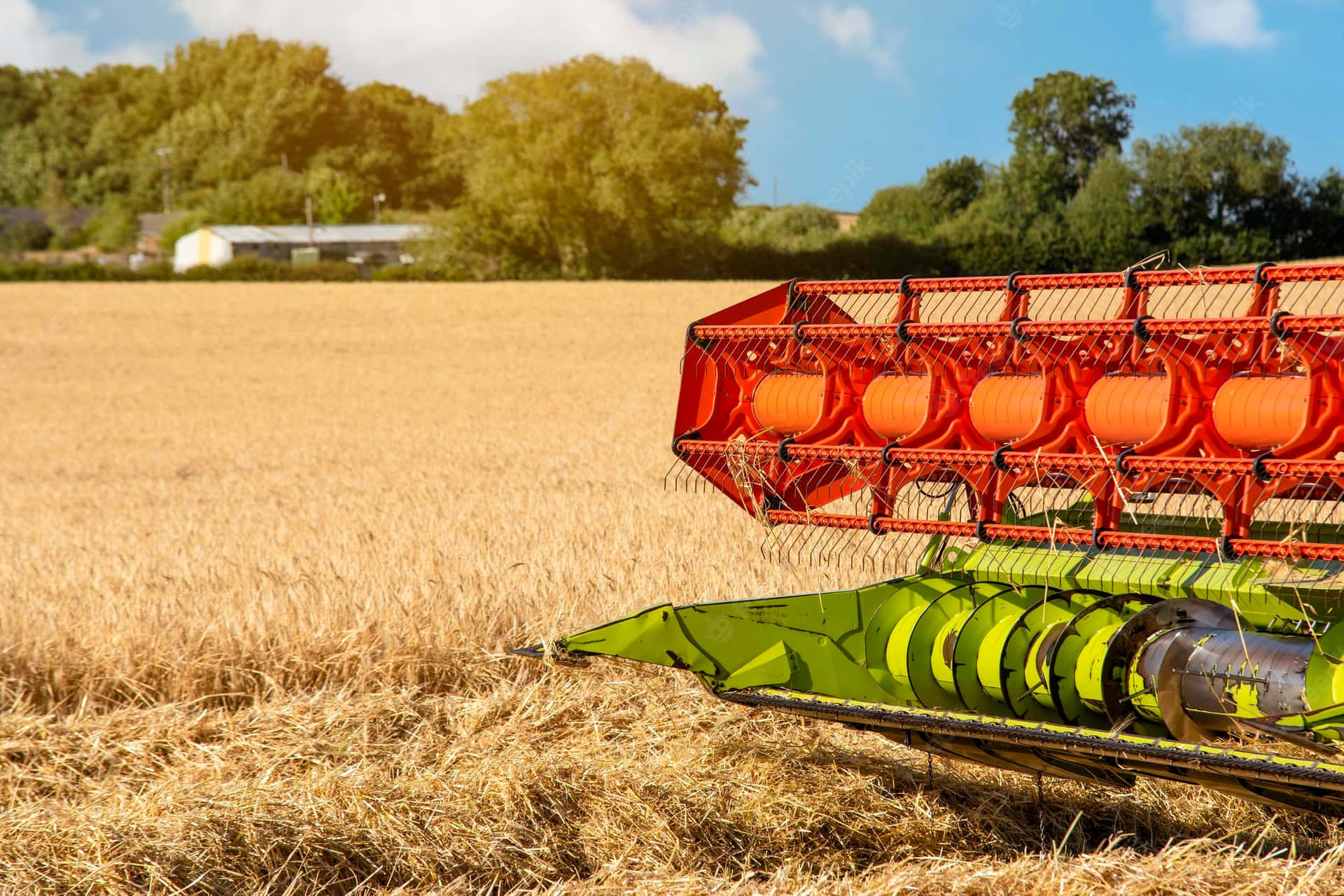 A Combine Harvester Is In The Field Wallpaper