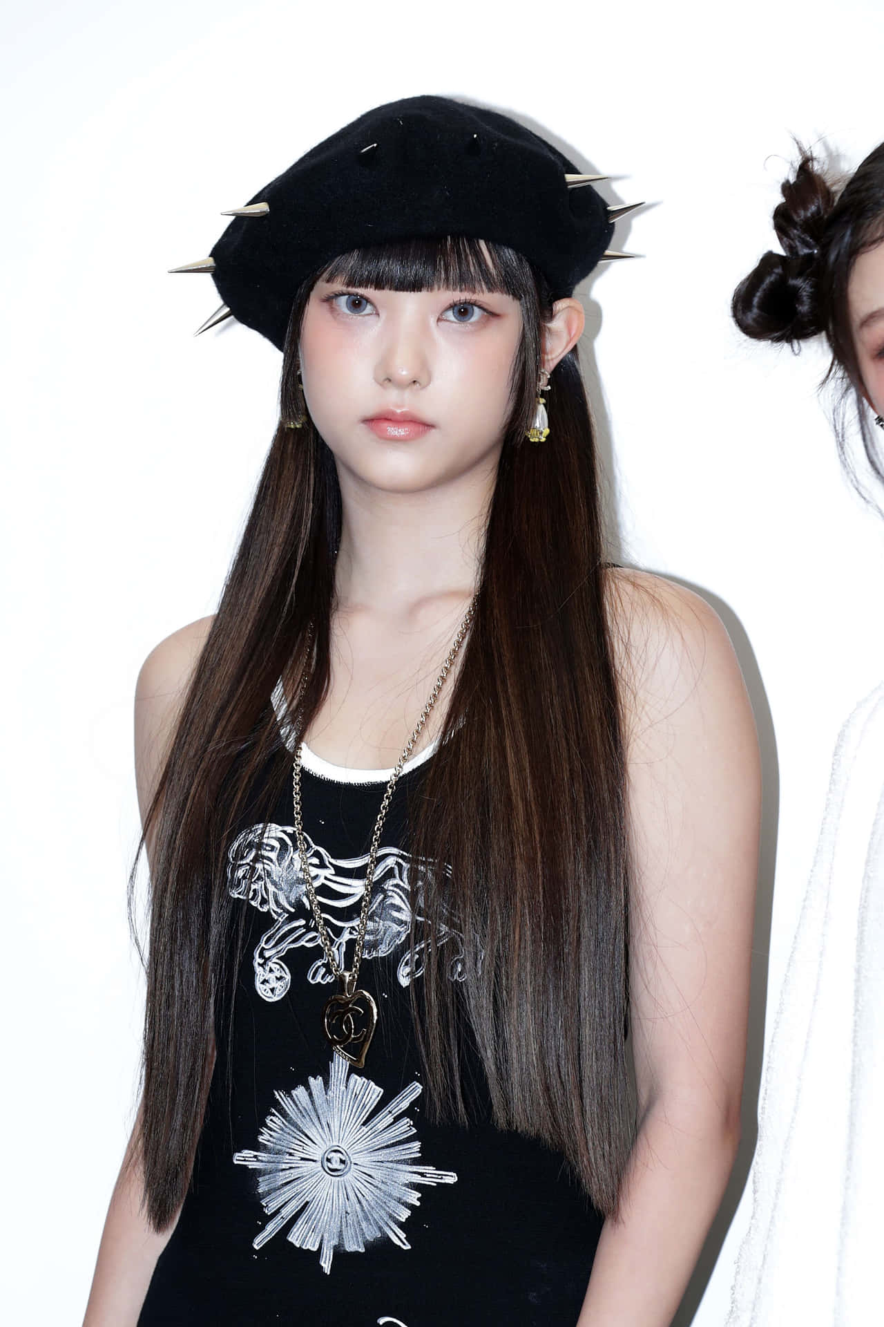 Fashionable Young Womanin Black Hatand Dress Wallpaper