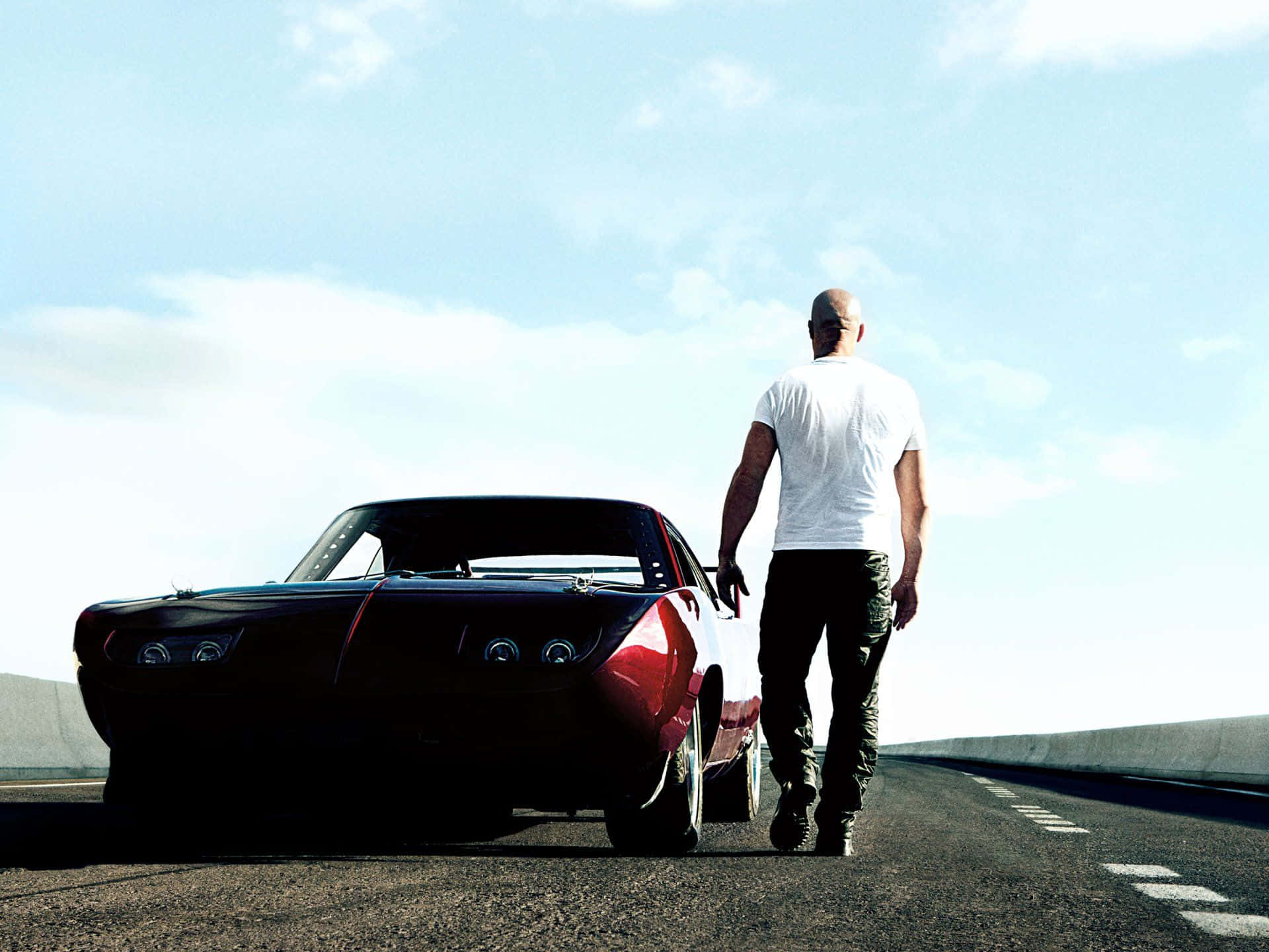 Dominic Checking His Car Fast And Furious 1 Wallpaper