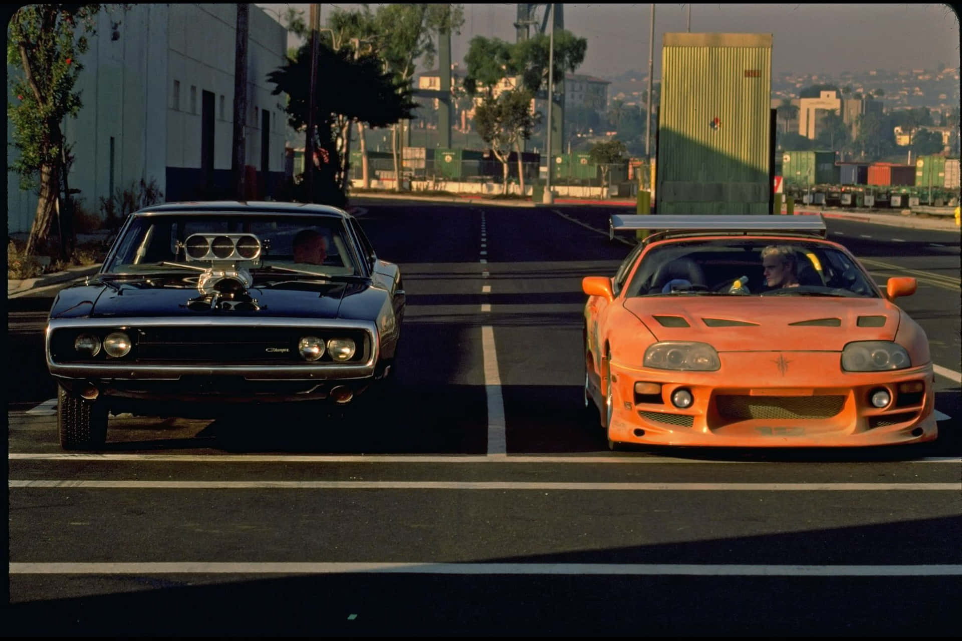 Two Cars Racing In Fast And Furious 1 Wallpaper