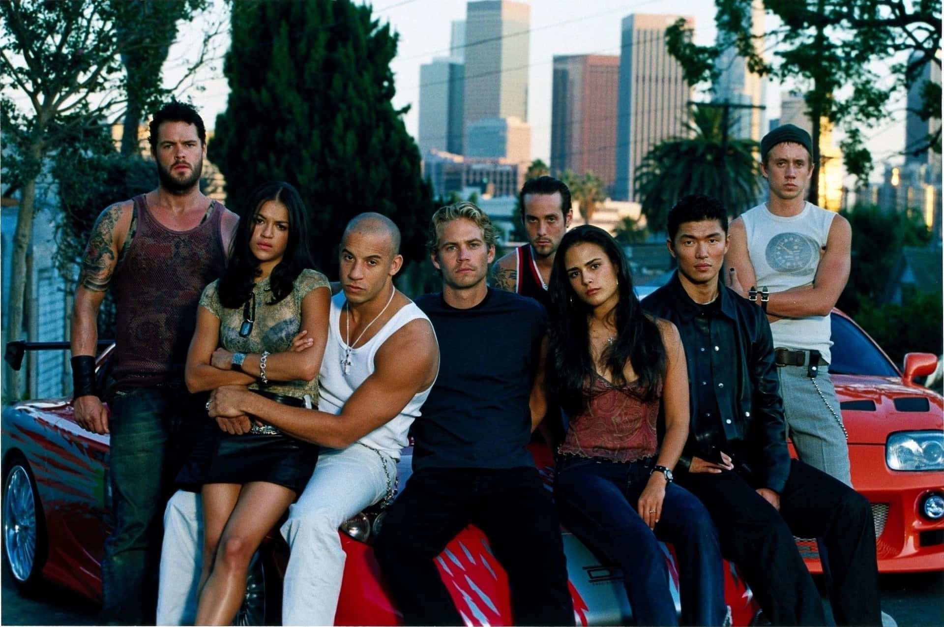The Fast And The Furious Cast Pose On A Red Car