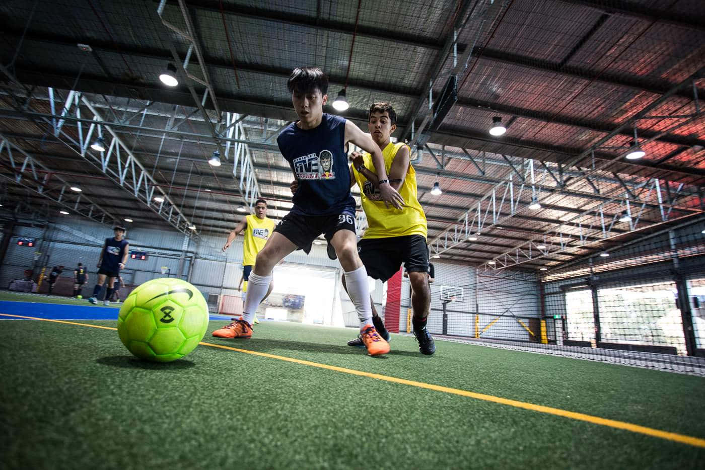 Fast-paced Indoor Soccer Action Wallpaper