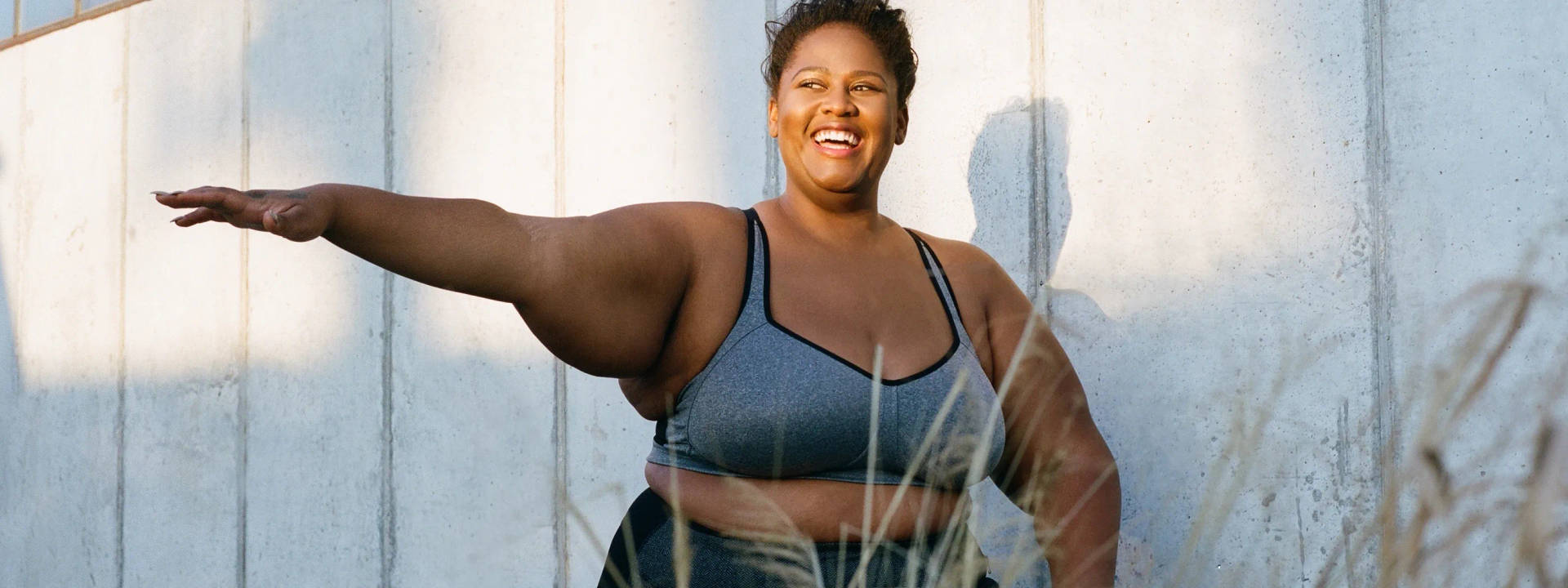 Fat Black Woman Exercising While Smiling Wallpaper
