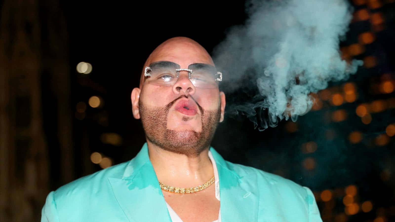 Fat Joe Exhaling Smoke Nighttime Backdrop Wallpaper