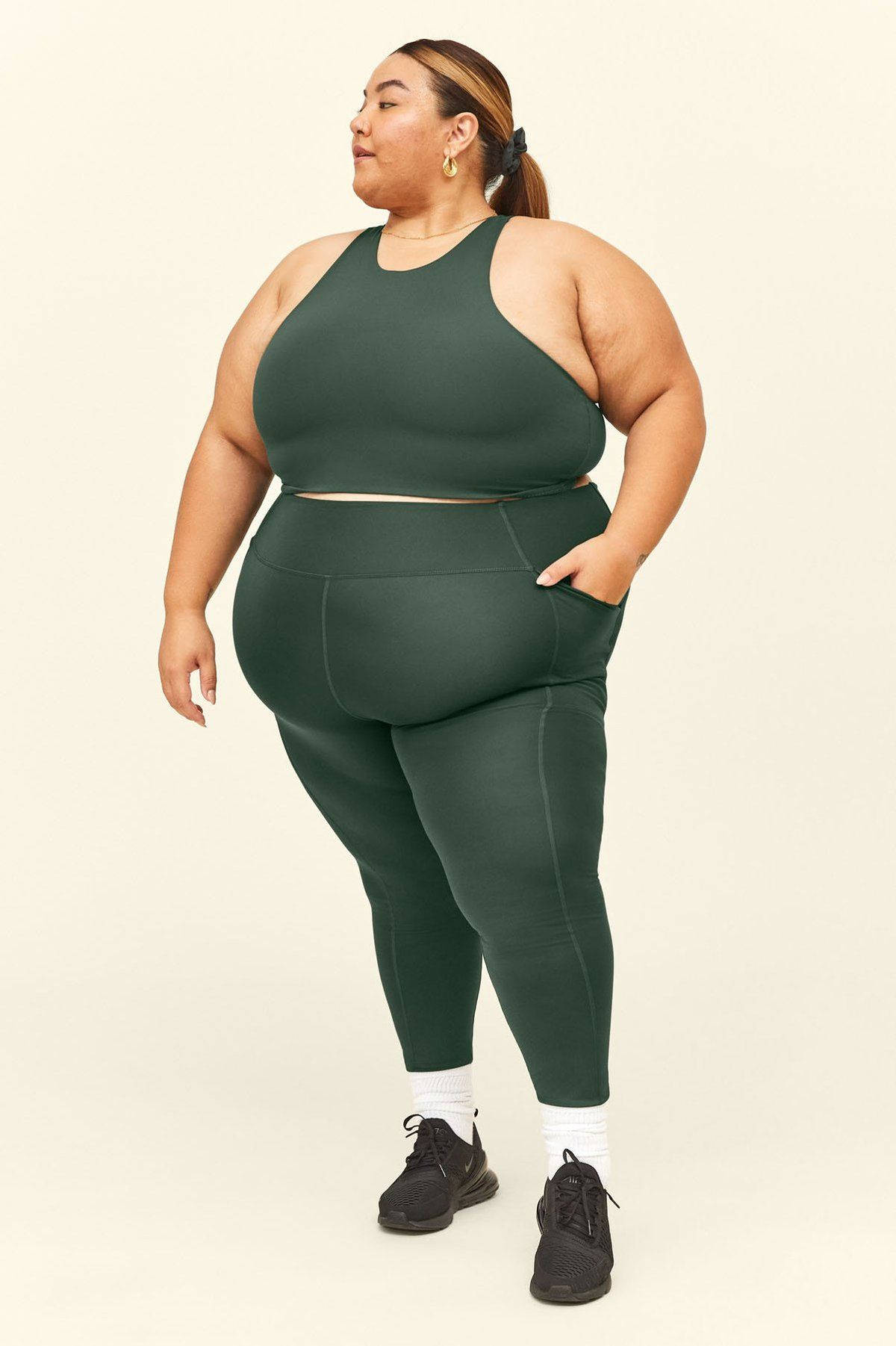 Fat Woman In Green Workout Clothes Wallpaper