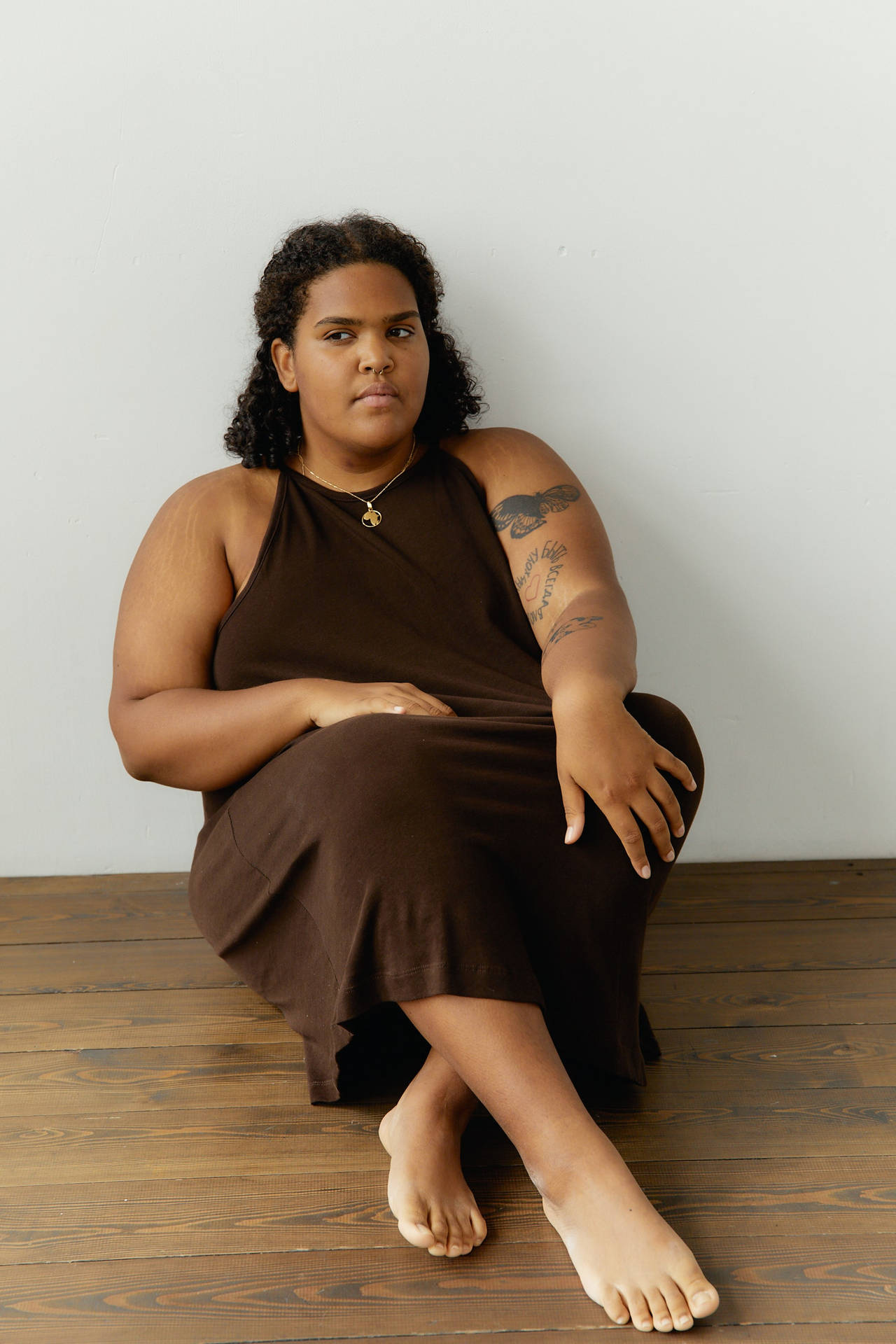 Plus-size Woman Embracing Body Confidence Wallpaper