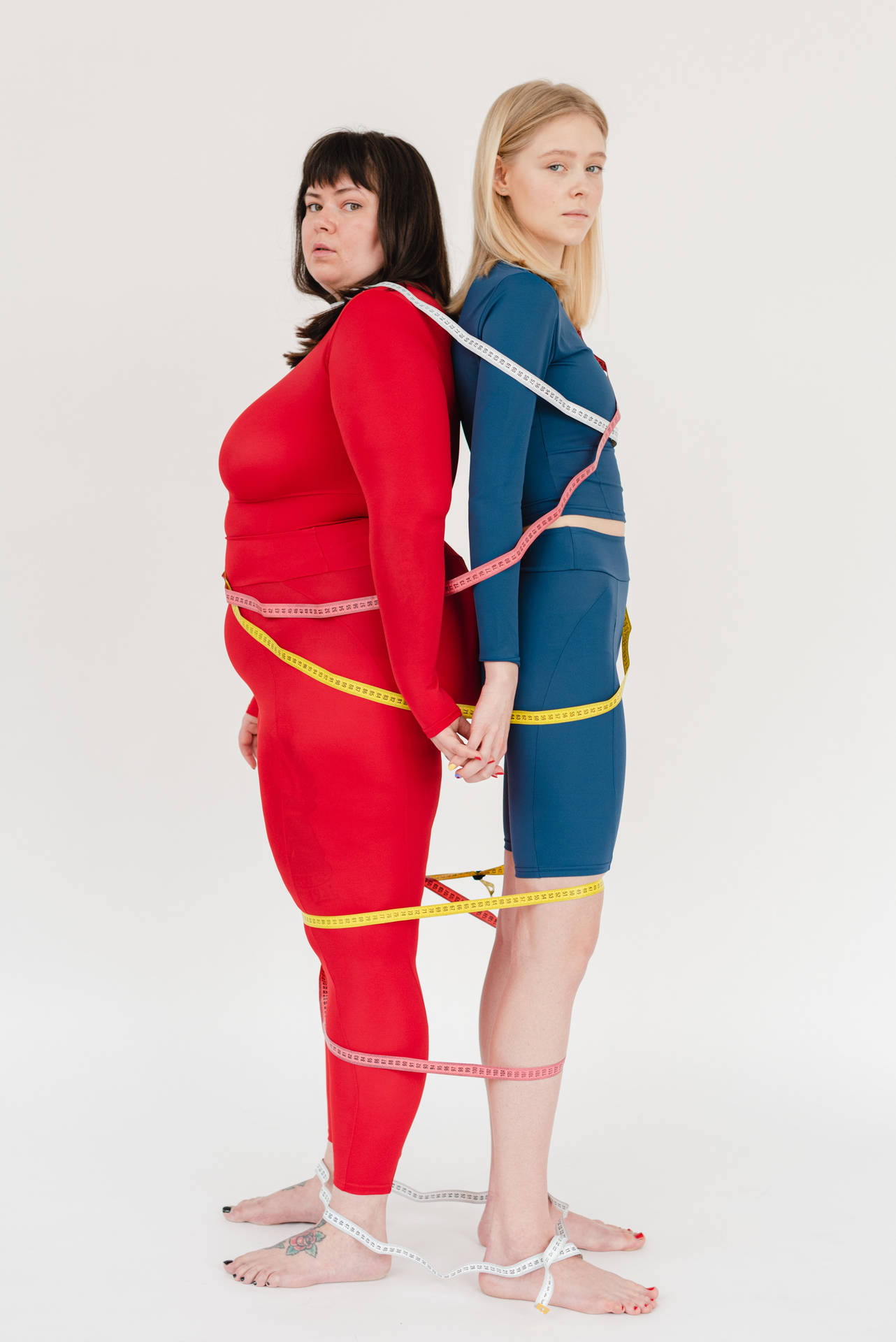 Fat Woman Tied To Thin Woman Wallpaper