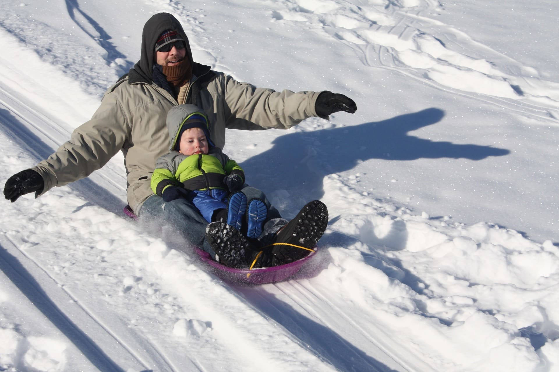 Father And Son Sledding Wallpaper