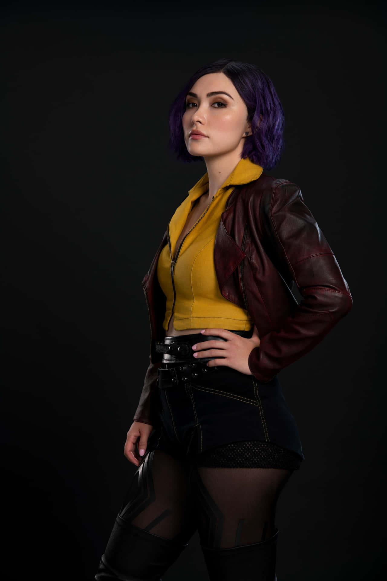 Faye Valentine striking a pose in front of a futuristic backdrop. Wallpaper