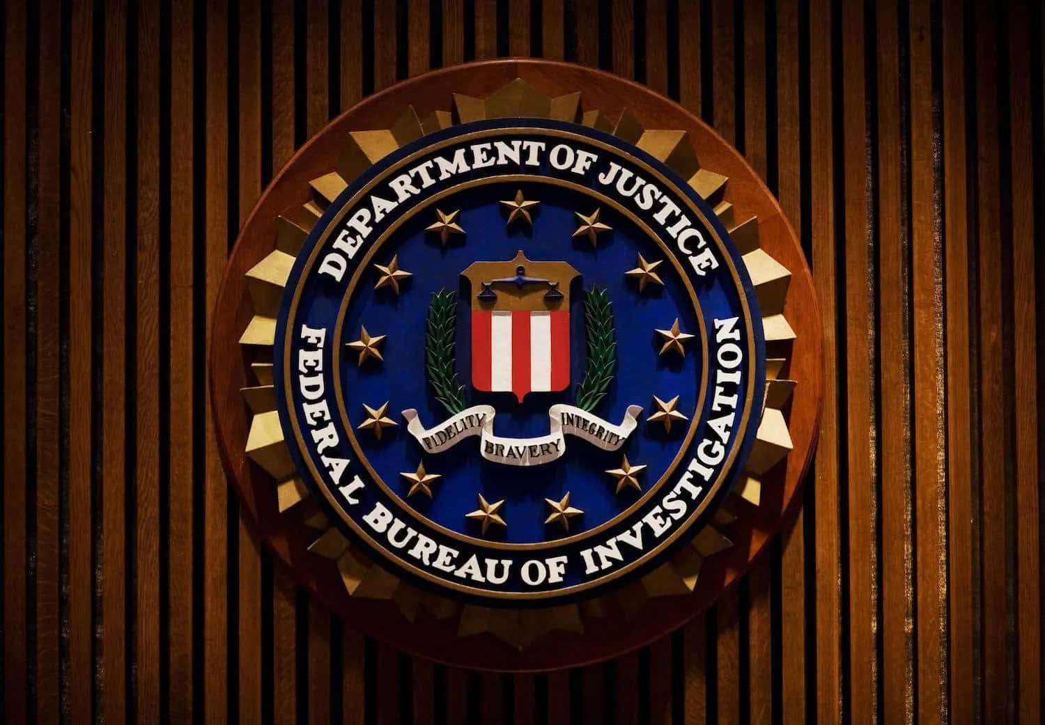 The Fbi Logo Is Shown On A Wooden Wall