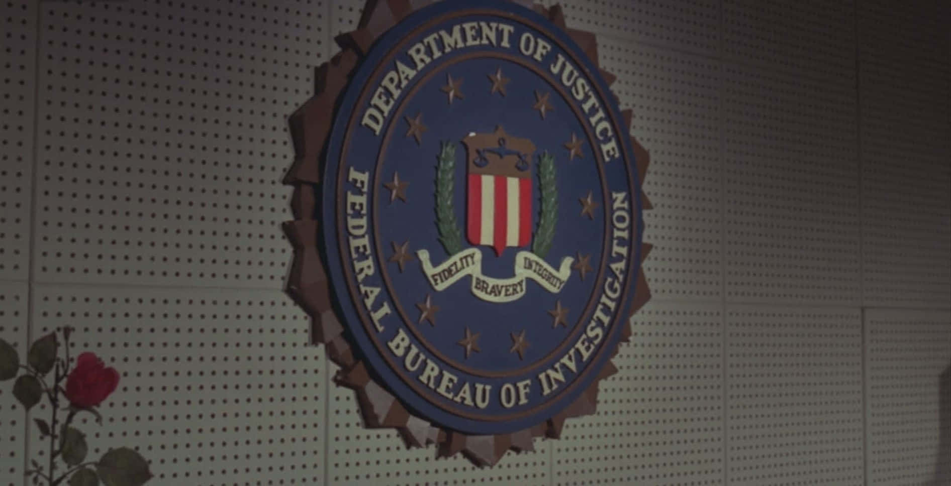 Caption: FBI Emblem on a Dark Background