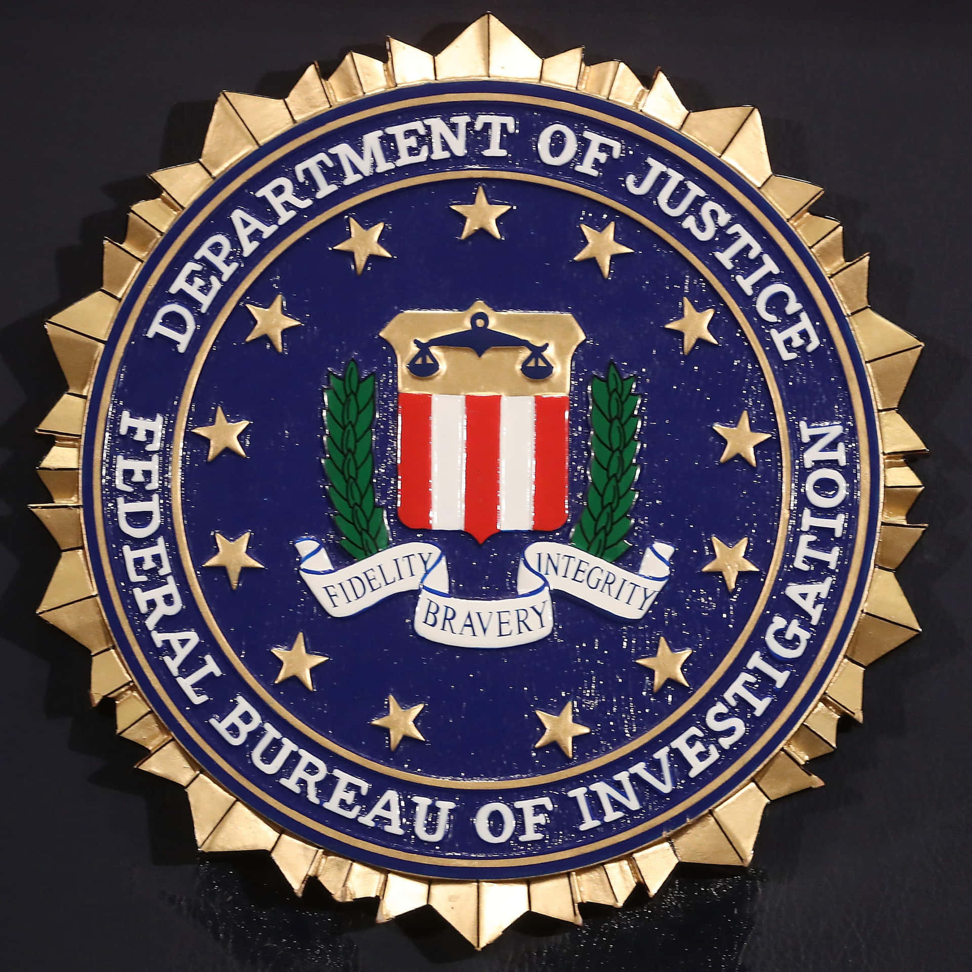 The Department Of Justice Seal Is Shown On A Black Background