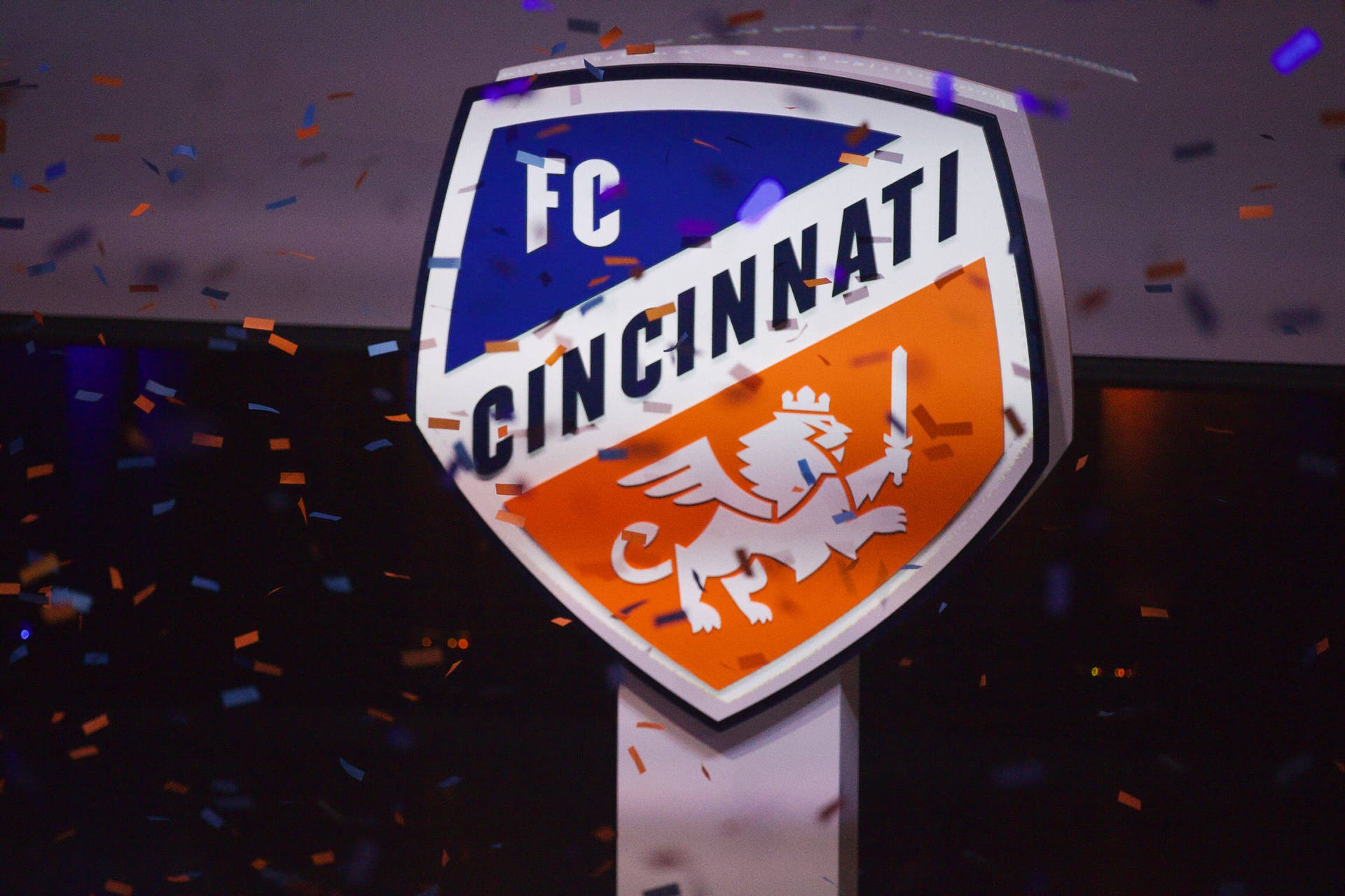 Fc Cincinnati Logo Surrounded By A Confetti Wallpaper