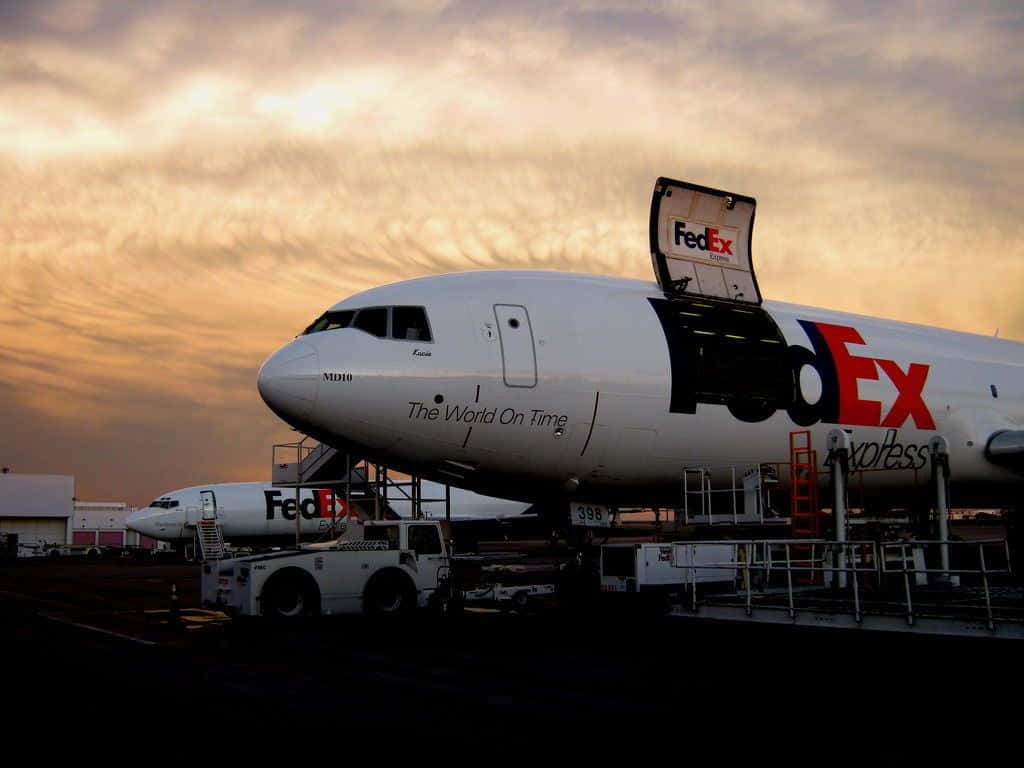 A Fedex Plane Is Parked On The Tarmac