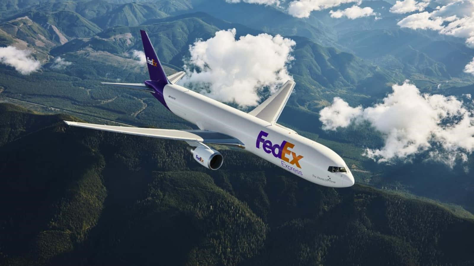 Fedex - A Jet Flying Over Mountains