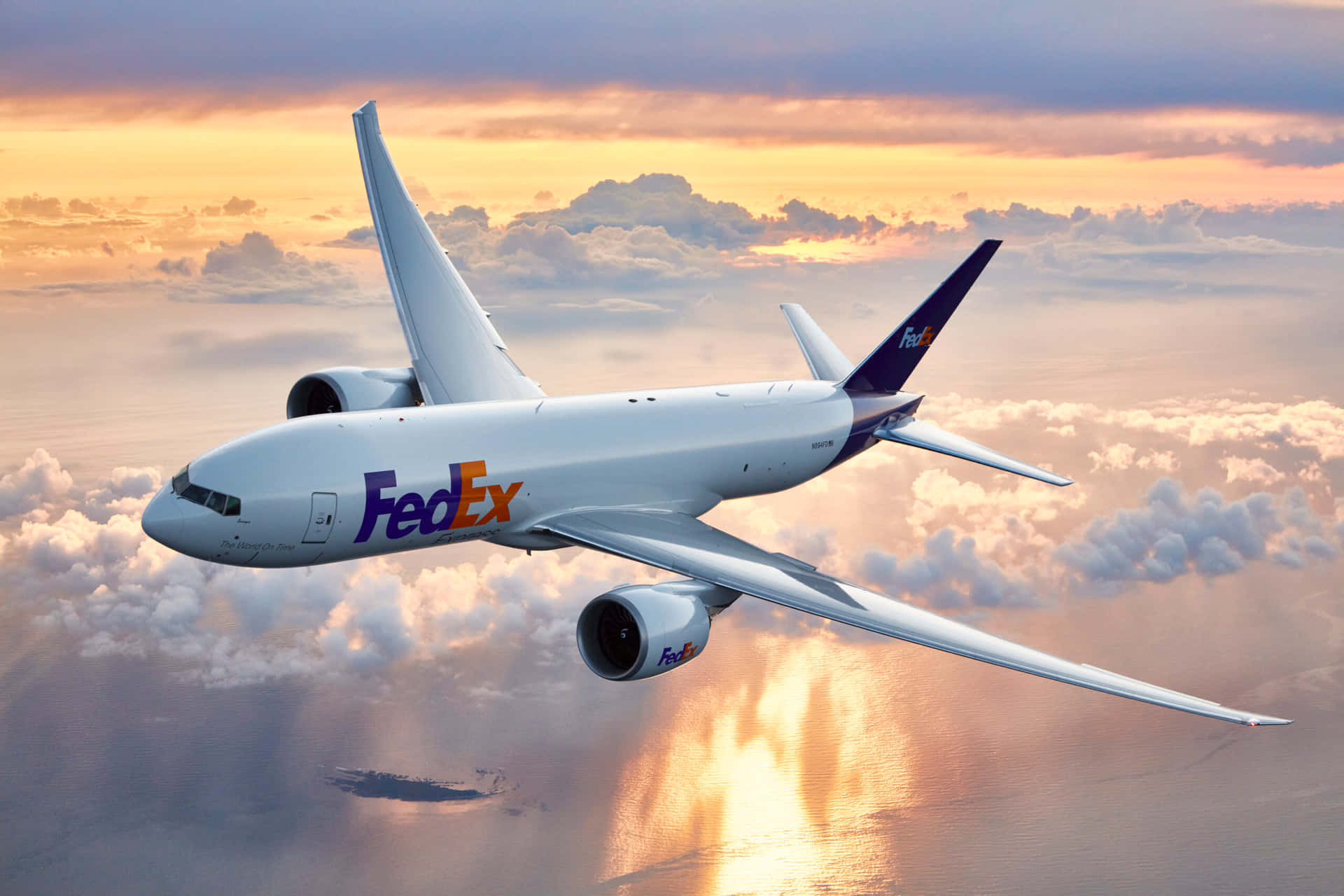 Fedex - A Large Jet Flying Over The Ocean