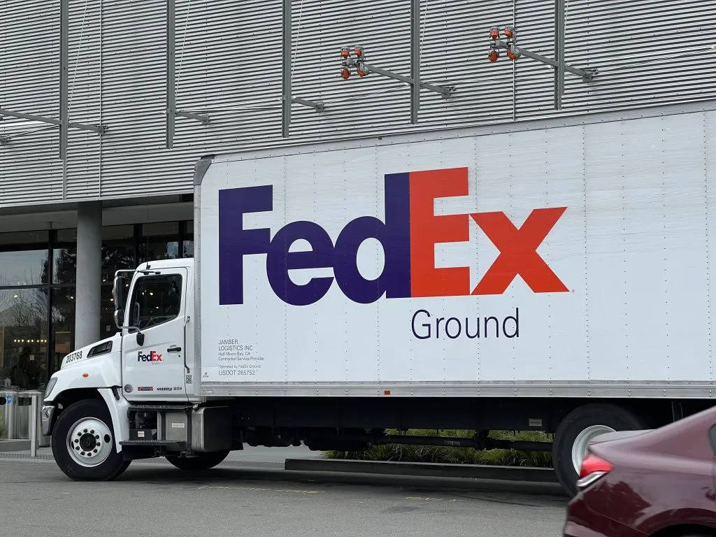 FedEx Tracking Delivery Truck Parked Wallpaper