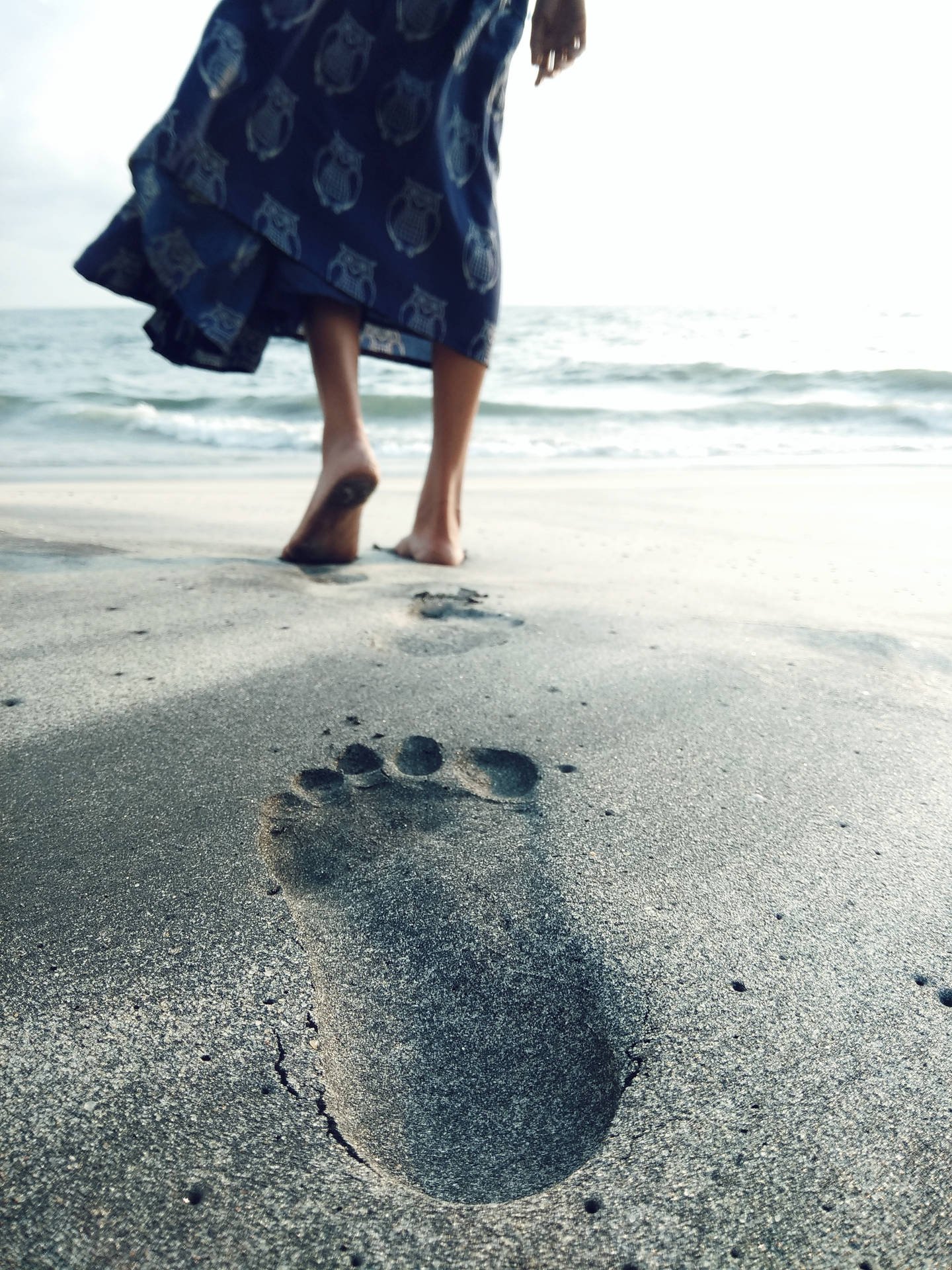 Feet And Footprints On The Sand Wallpaper