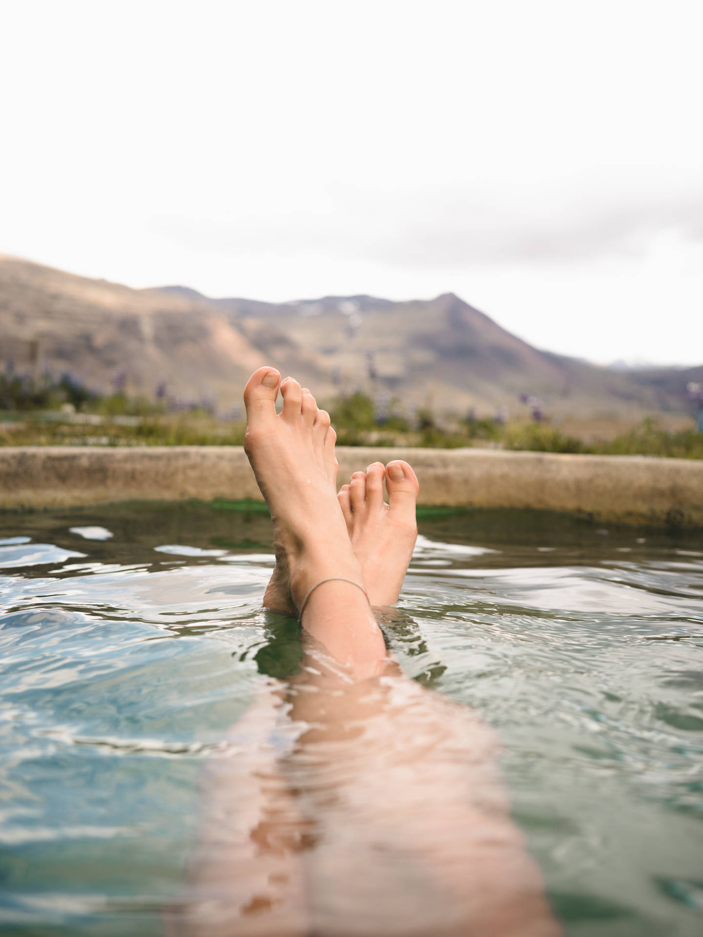 Relaxing Summer Days - Feet Floating in a Pool Wallpaper