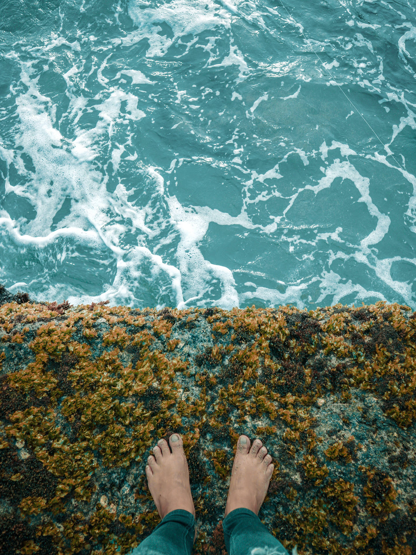Feet On Edge Of A Cliff Wallpaper