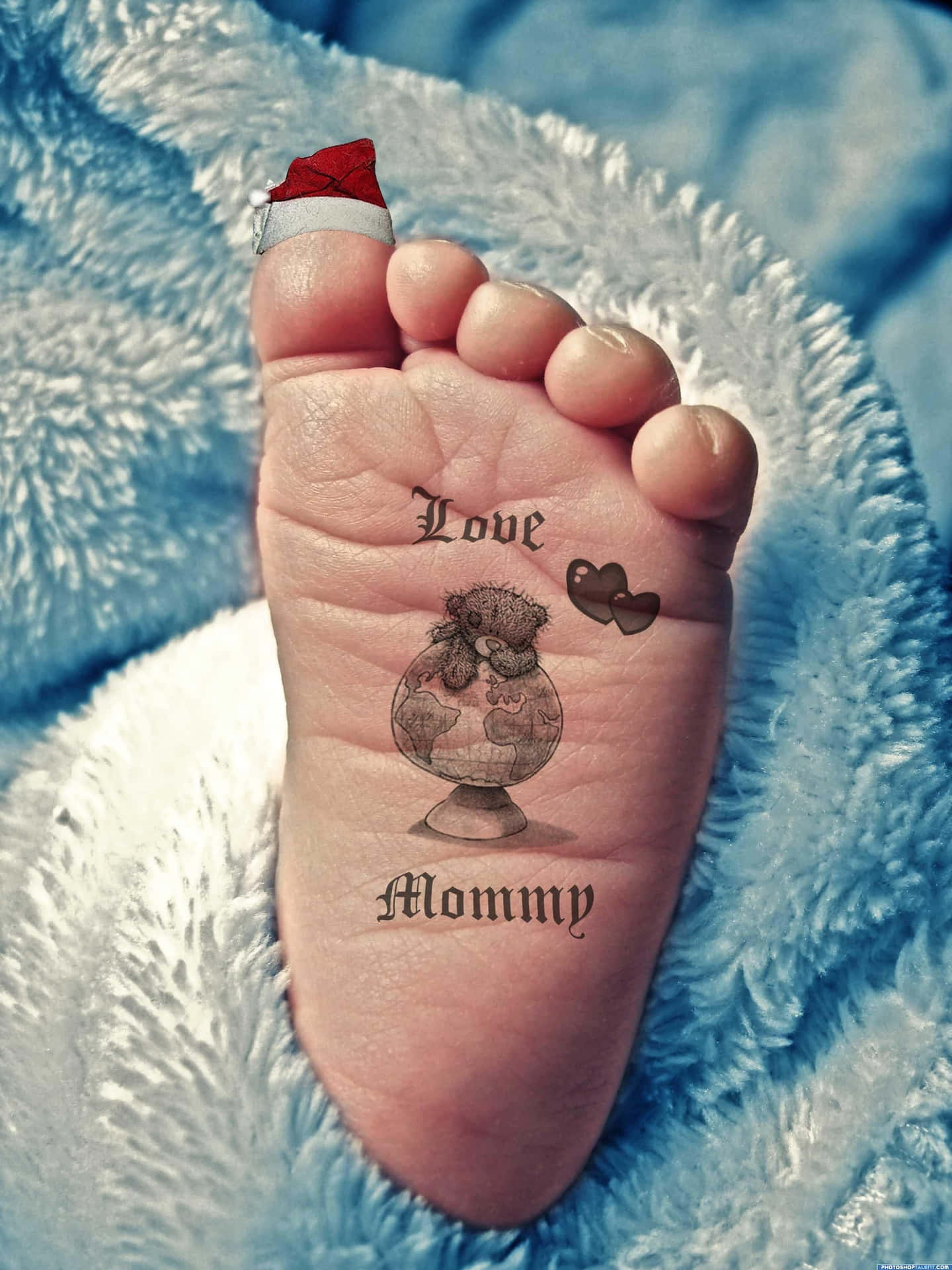 A Baby's Foot With A Santa Hat On It
