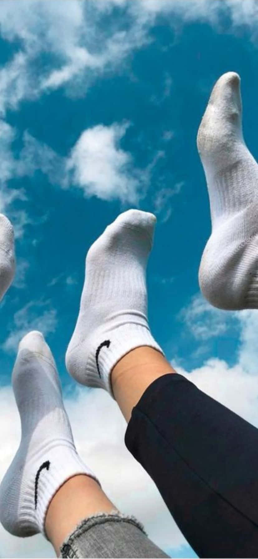 Feet Up Against Sky With White Socks.jpg Wallpaper
