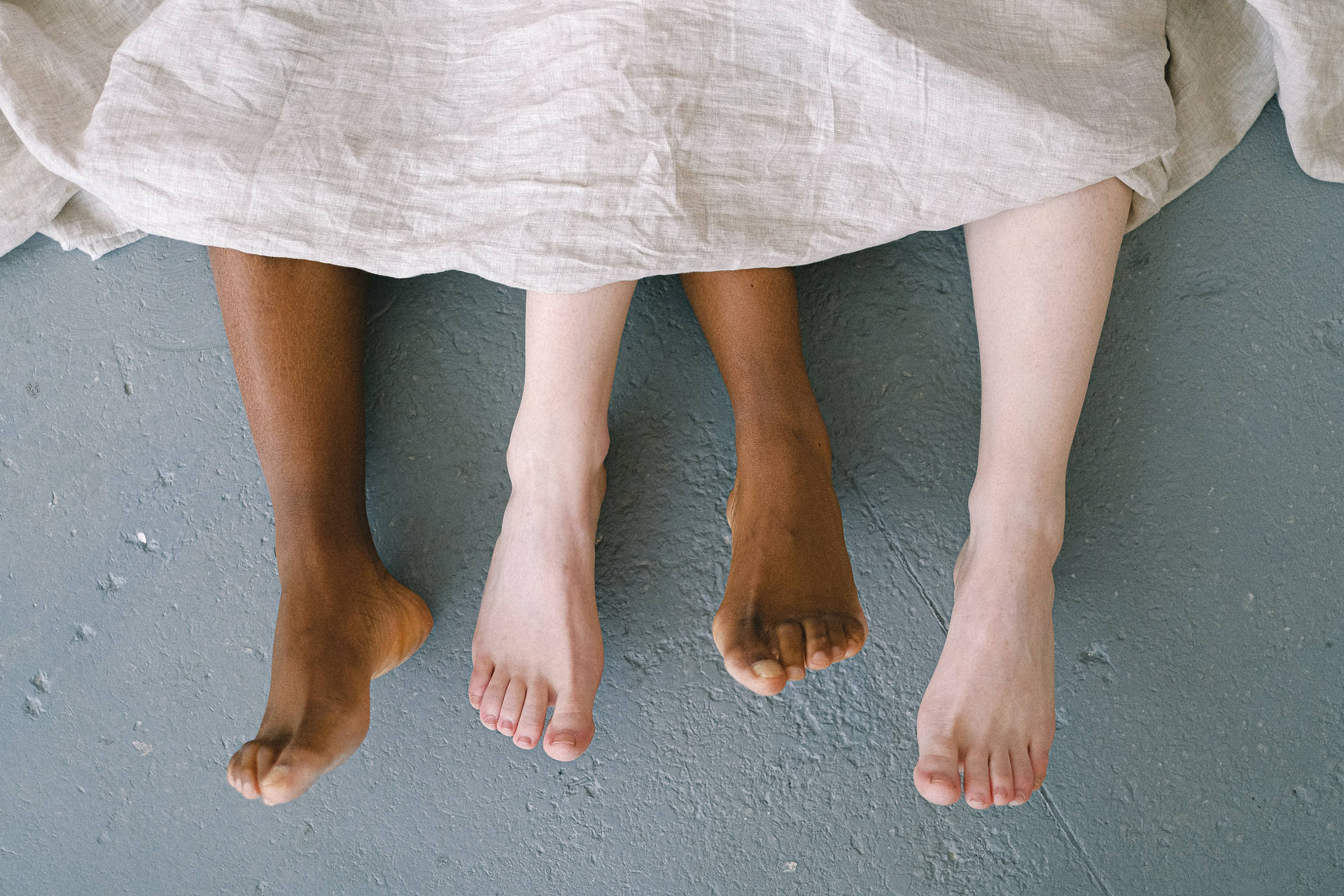 Feet With Contrasting Complexions Wallpaper