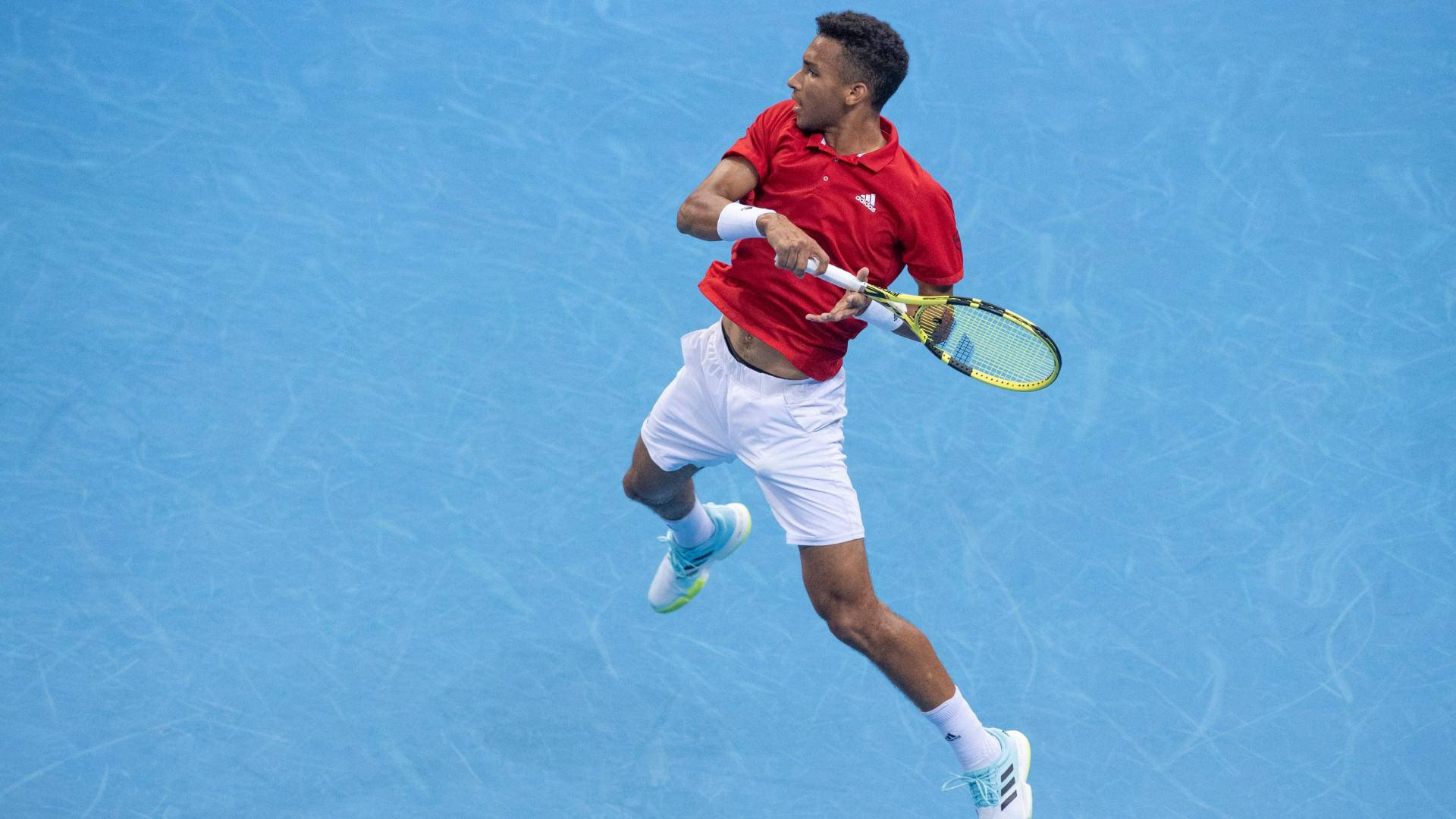 Caption: Professional Tennis Player Felix Auger Aliassime Showcasing His Footwork Skills Off the Court Wallpaper