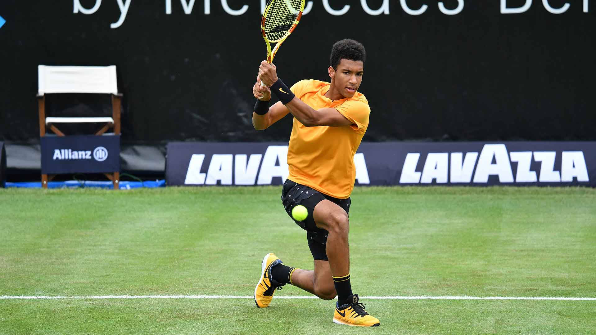 Felix Auger-Aliassime in action on the tennis court Wallpaper