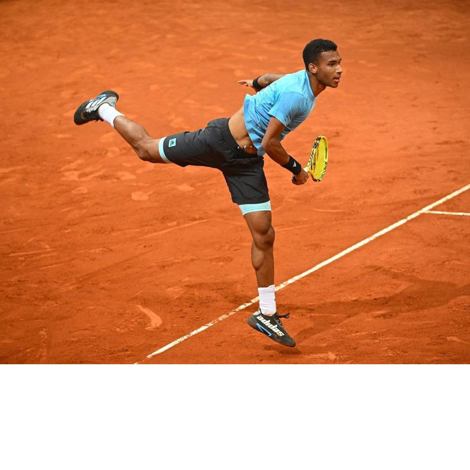 Felix Auger-Aliassime Playing on Clay Court Wallpaper
