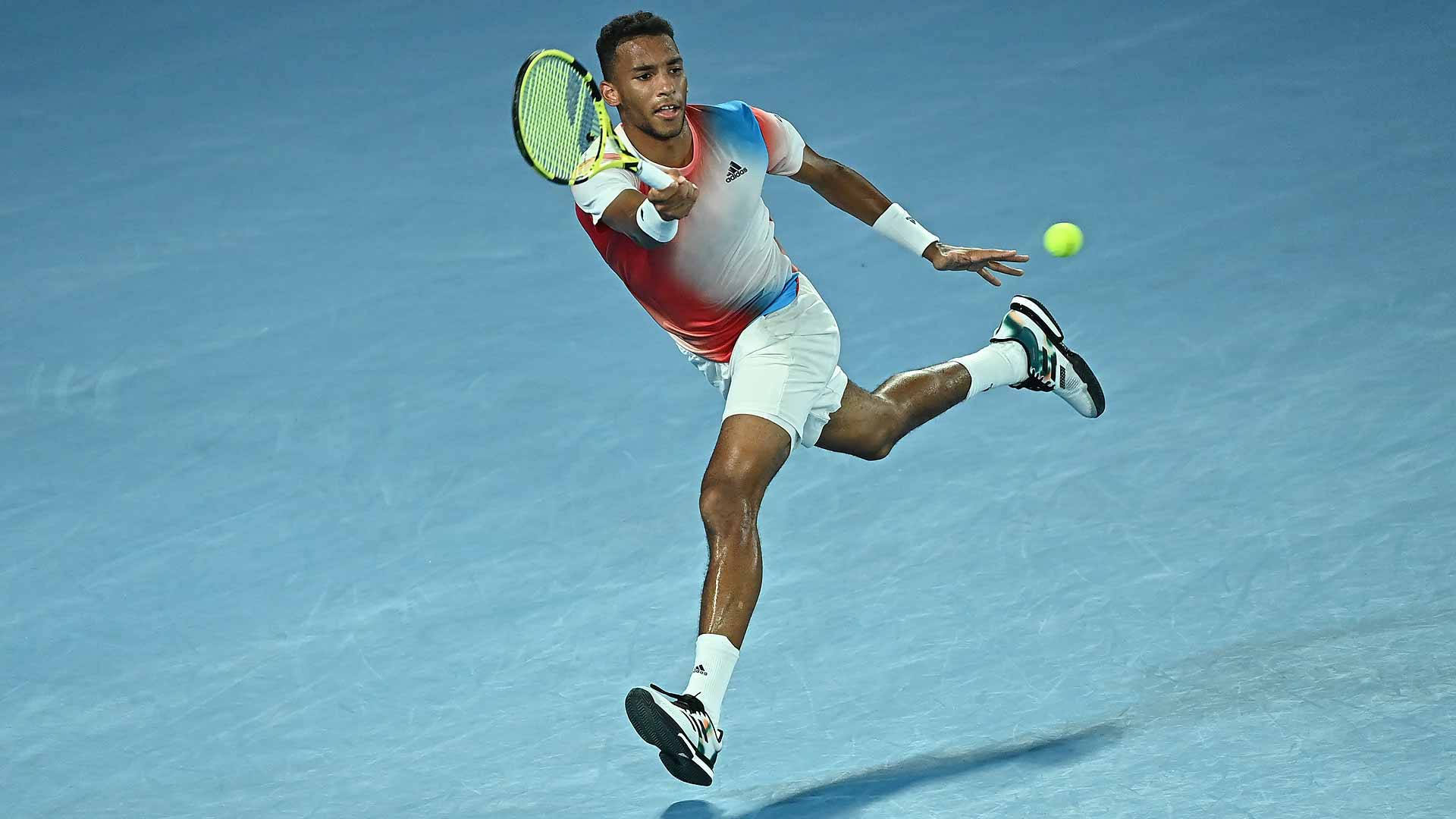 Tennis Prodigy Felix Auger Aliassime in Action Wallpaper