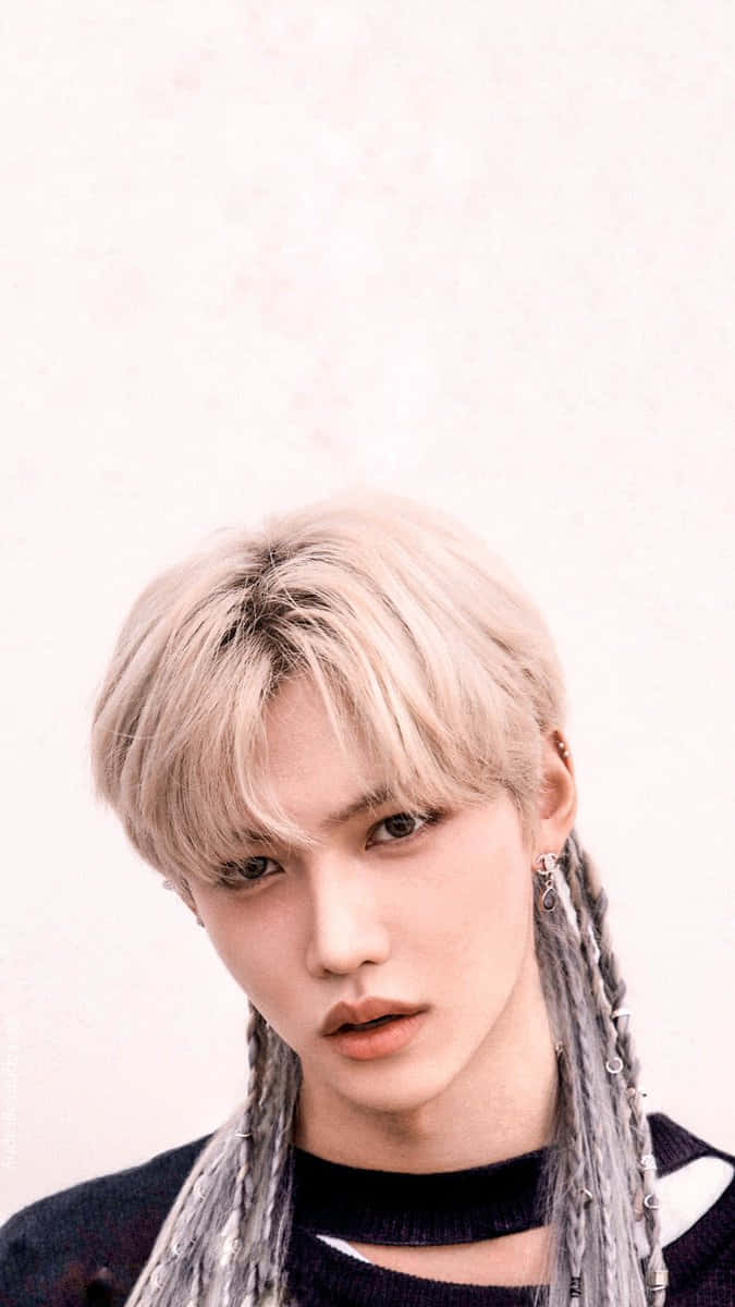 "Felix of Stray Kids posing confidently in front of the camera" Wallpaper
