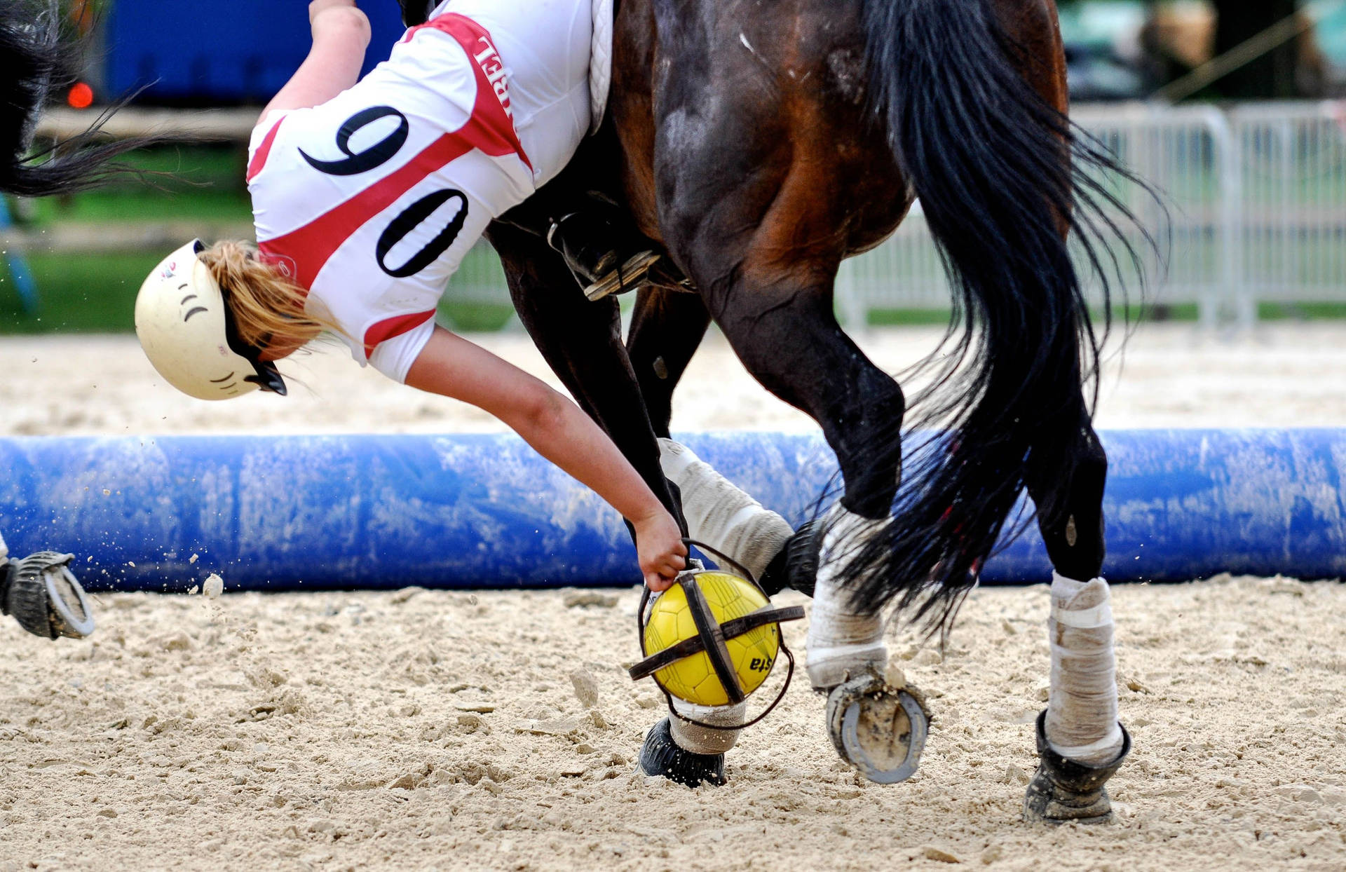 Female Equestrian Falling During Her Match Wallpaper