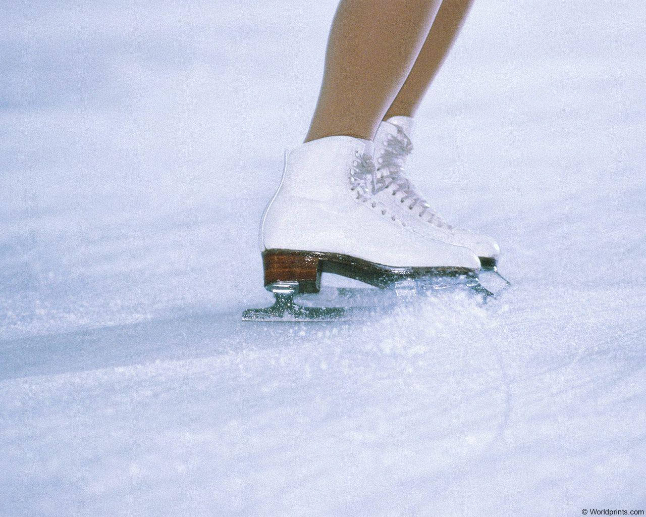 Female Ice Skating Shoes In Rink Wallpaper
