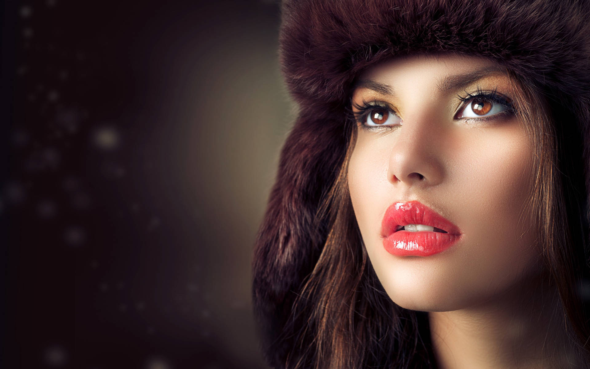 Elegance Redefined: Female Model in Fur Hat Wallpaper