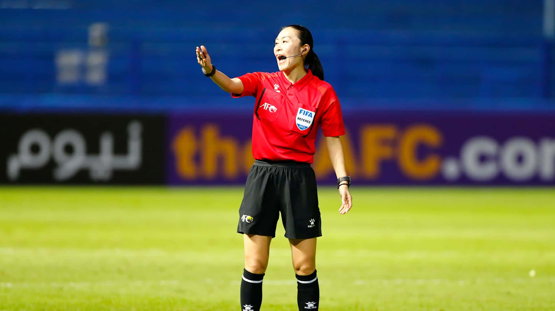 Female Soccer Referee Action Shot.jpg Wallpaper