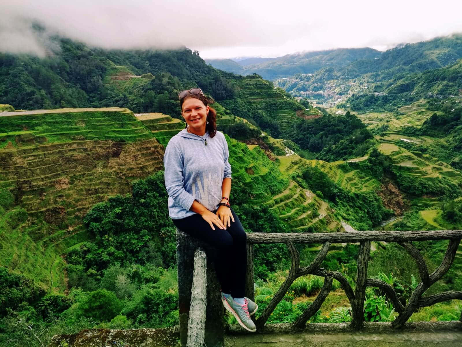 Enthralled tourist exploring Banaue Rice Terraces in the Phillippines. Wallpaper