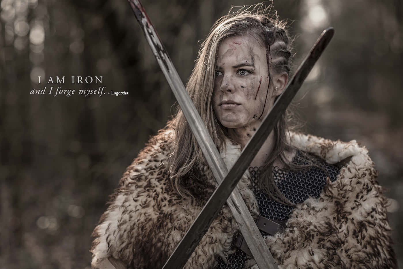 A Woman In A Viking Costume Holding Two Swords
