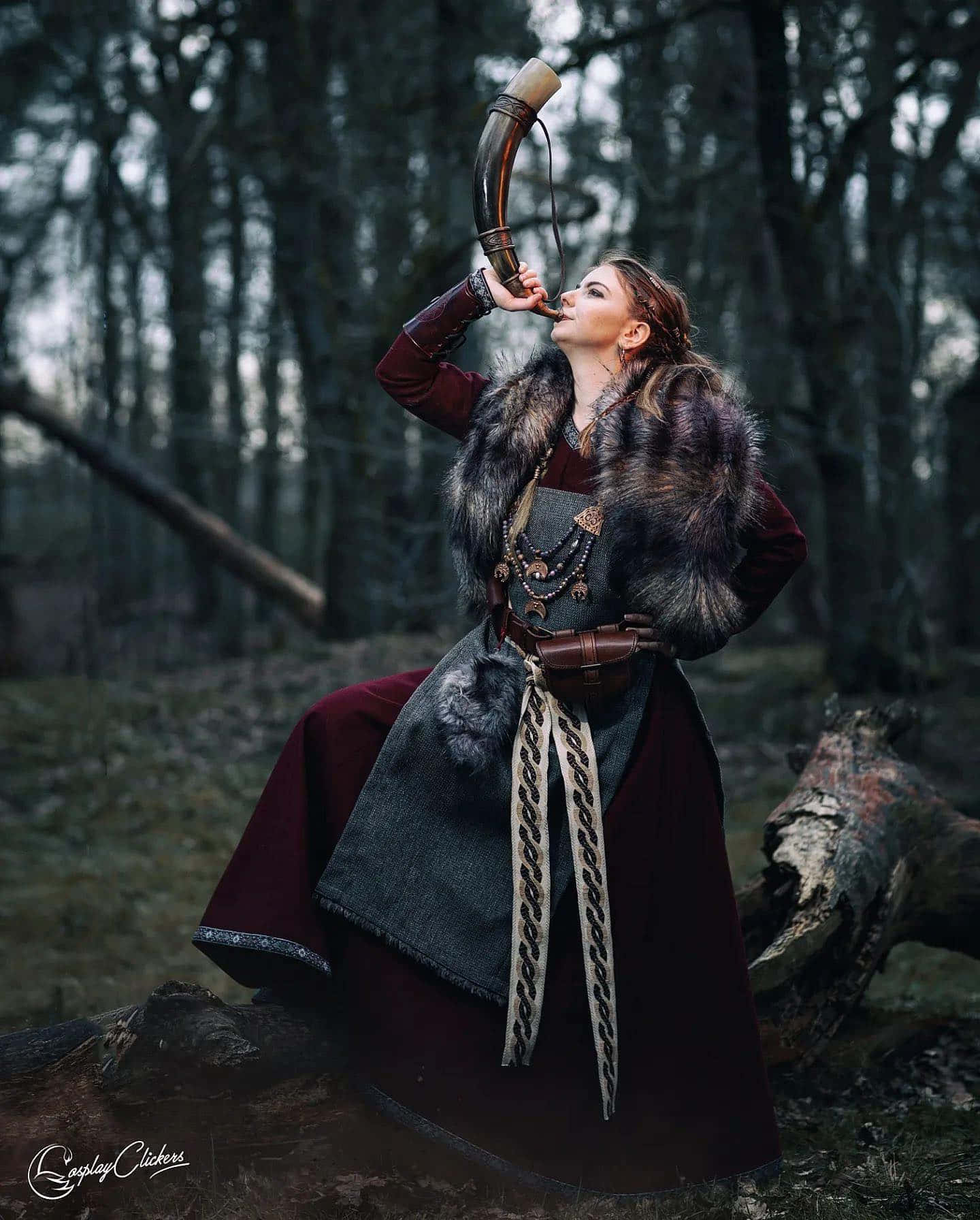 Viking Woman In A Fur Coat Drinking From A Horn